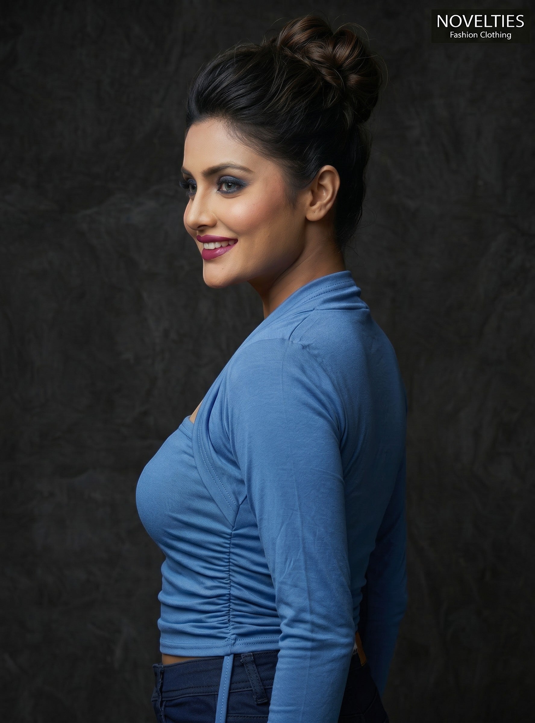 Model wearing a blue Novelties® square neck tube top with an attached long sleeve shrug overlay and ruched detailing.
