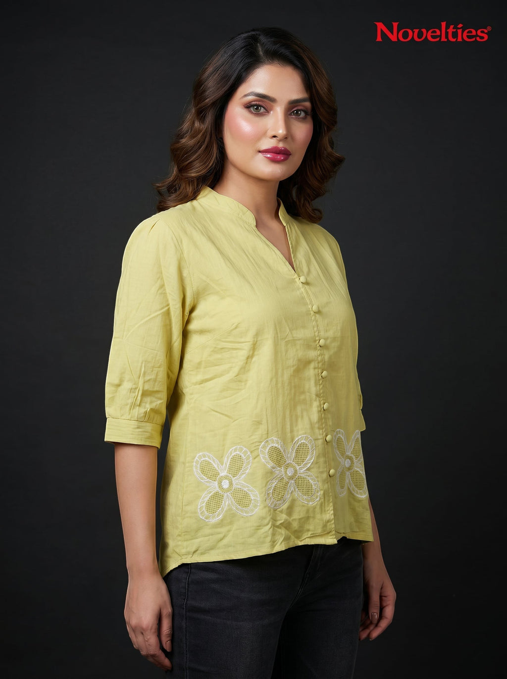 Model wearing a lime green Novelties® mandarin collar shirt with white floral cutwork embroidery at the hem.