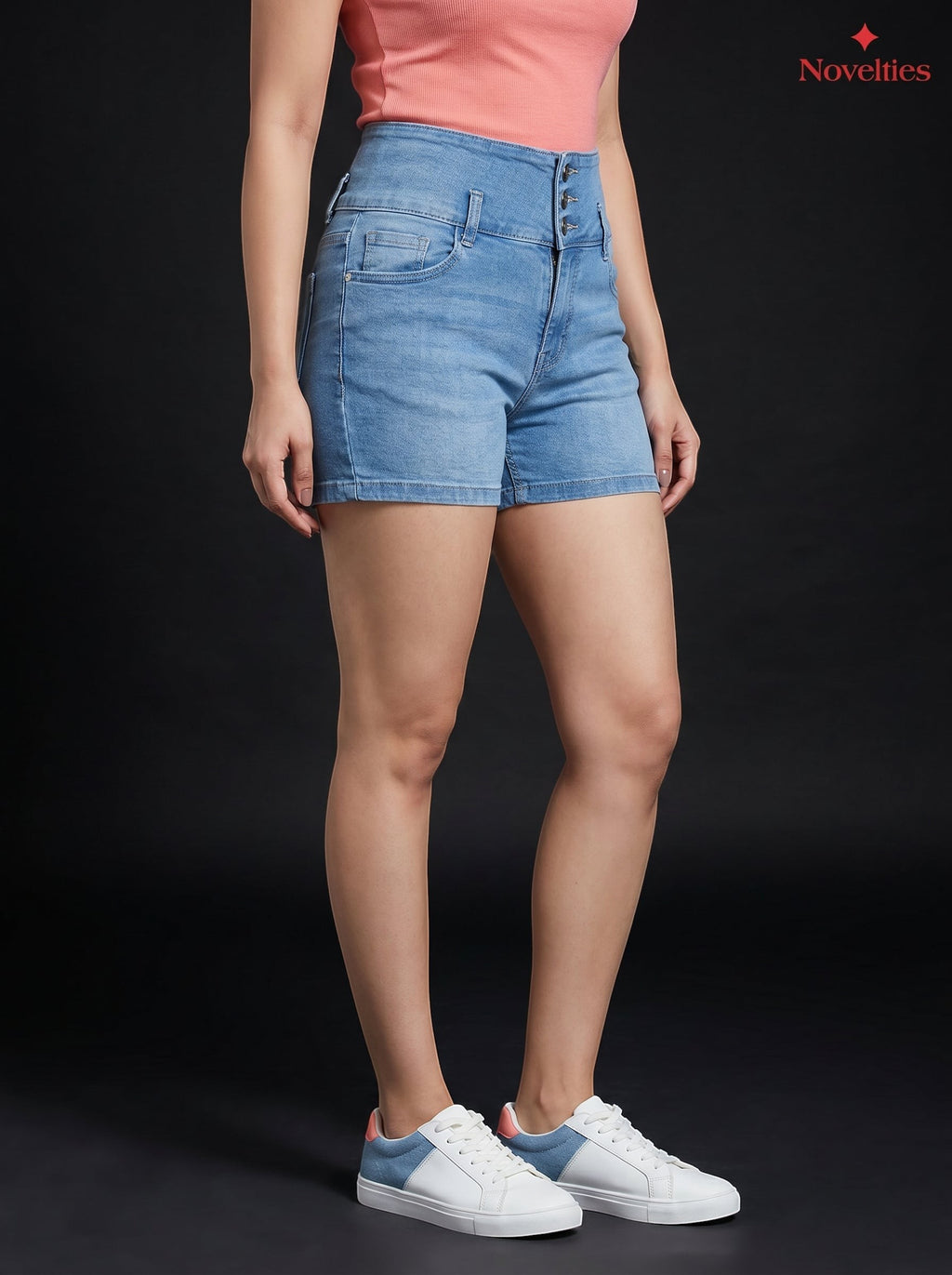 Novelties® light blue high-waist denim hot shorts with triple-button closure and faded wash on a model.