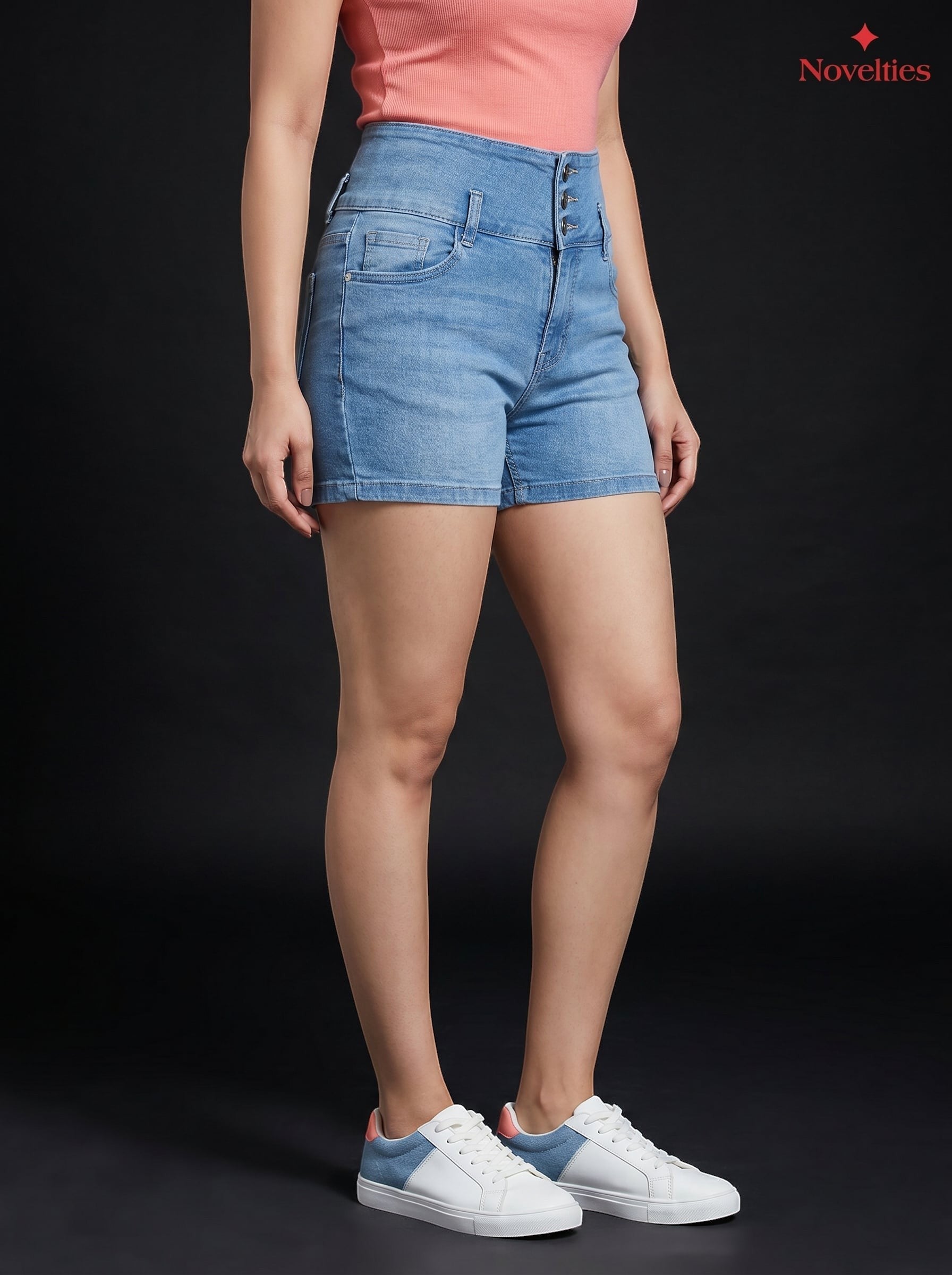 Novelties® light blue high-waist denim hot shorts with triple-button closure and faded wash on a model.