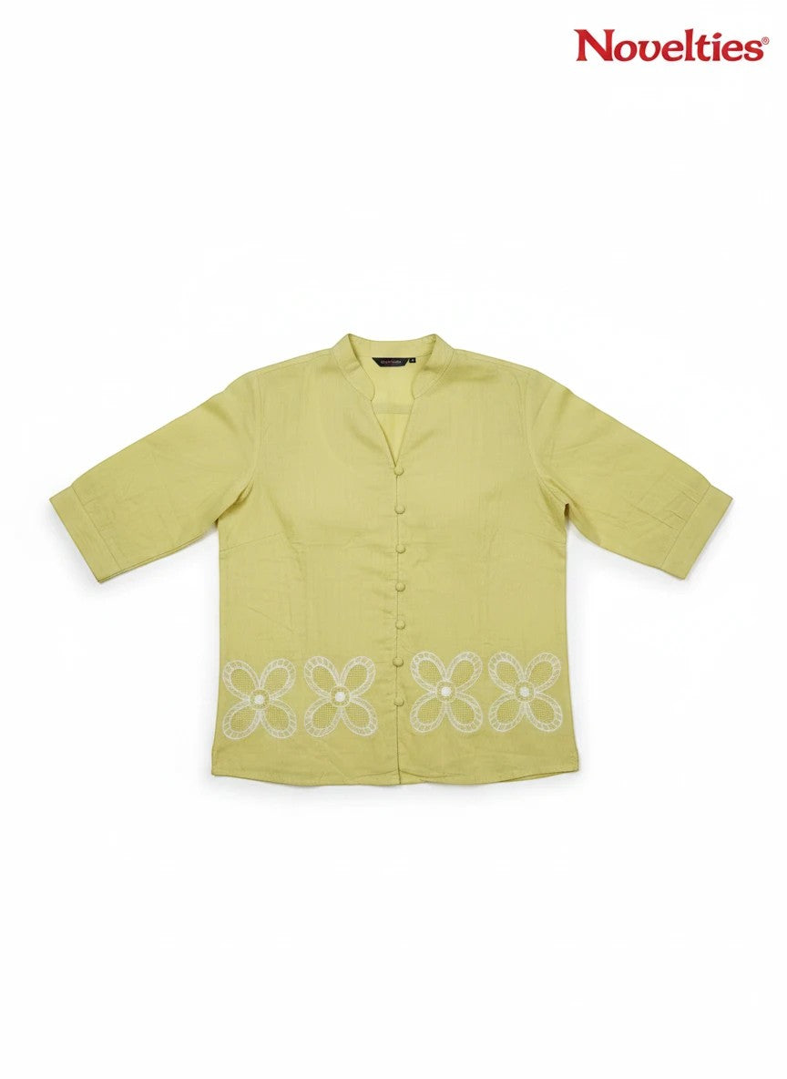 Novelties® lime green mandarin collar shirt featuring white cutwork floral embroidery at the hem and button-down front.
