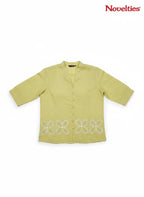 Novelties® lime green mandarin collar shirt featuring white cutwork floral embroidery at the hem and button-down front.