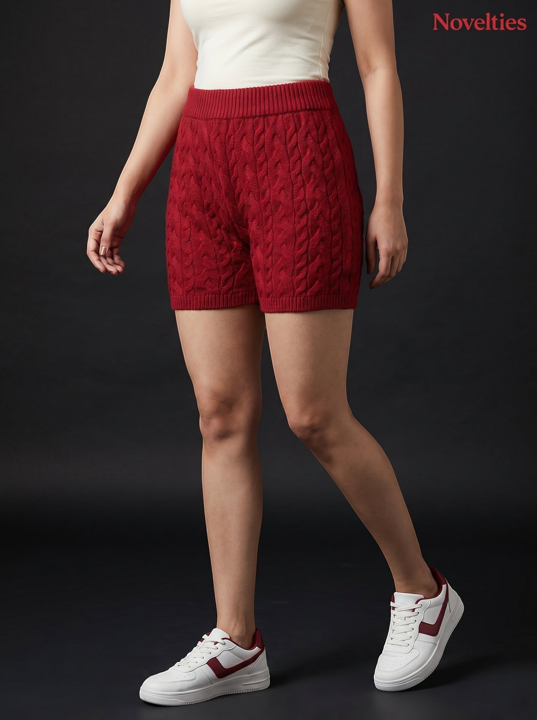 Model wearing Novelties® maroon cable-knit shorts with an elasticated waistband and ribbed hem for casual loungewear.
