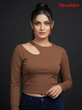 Model wearing a brown Novelties® ribbed long sleeve cropped top with an asymmetric shoulder cutout.
