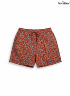 Novelties® rust terracotta shorts with a ditsy multicolour floral print, elasticated waist, and drawstring tie.