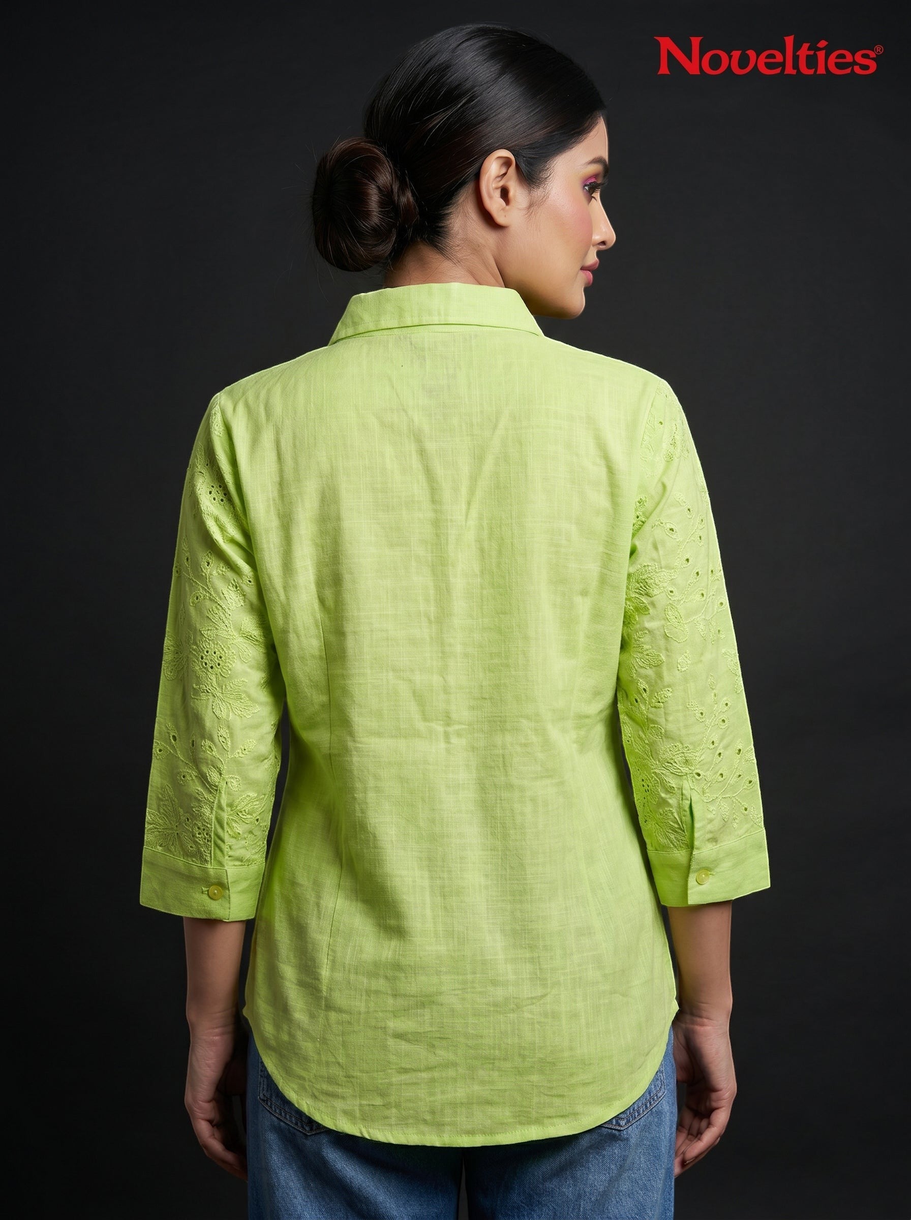 Model wearing a lime green Novelties® Schiffli embroidered shirt with three-quarter sleeves against a black background.