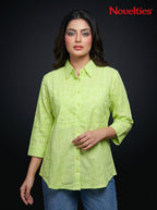 Model wearing a lime green Novelties® Schiffli embroidered button-down shirt with floral details and 3/4 sleeves.