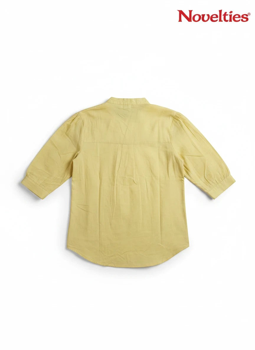 Novelties® pale yellow mandarin collar shirt with three-quarter sleeves and a clean back silhouette.