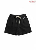 Novelties® black casual shorts with an elastic waistband, adjustable drawstring, and a relaxed, comfortable fit.