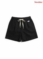 Novelties® black casual shorts with an elastic waistband, adjustable drawstring, and a relaxed, comfortable fit.